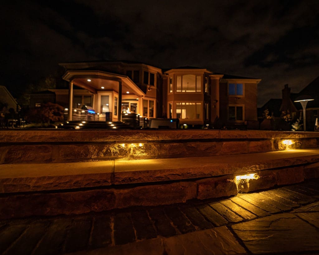 Dramatic outdoor lighting installation by Ground Works in Westlake, Ohio