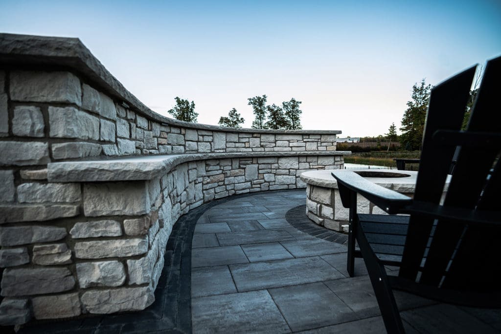 Stone patio with custom fire pit and entertaining area in Westlake, Ohio