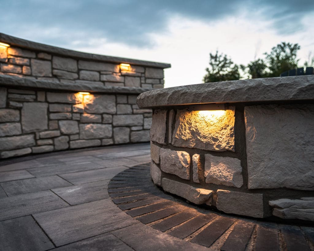 Stone patio with custom fire pit and entertaining area in Westlake, Ohio