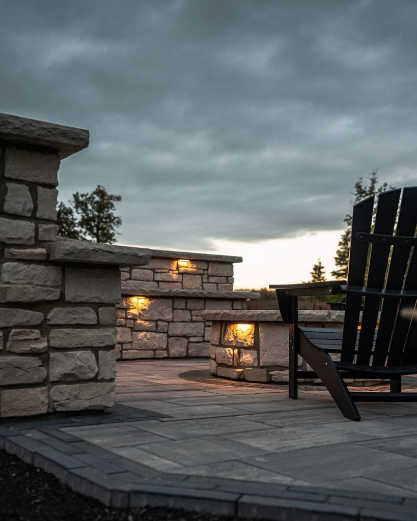 Stone patio with custom fire pit and entertaining area in Westlake, Ohio